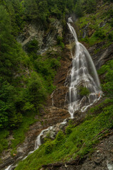 Kreealm waterfall in Austria Alps mountains on big wall