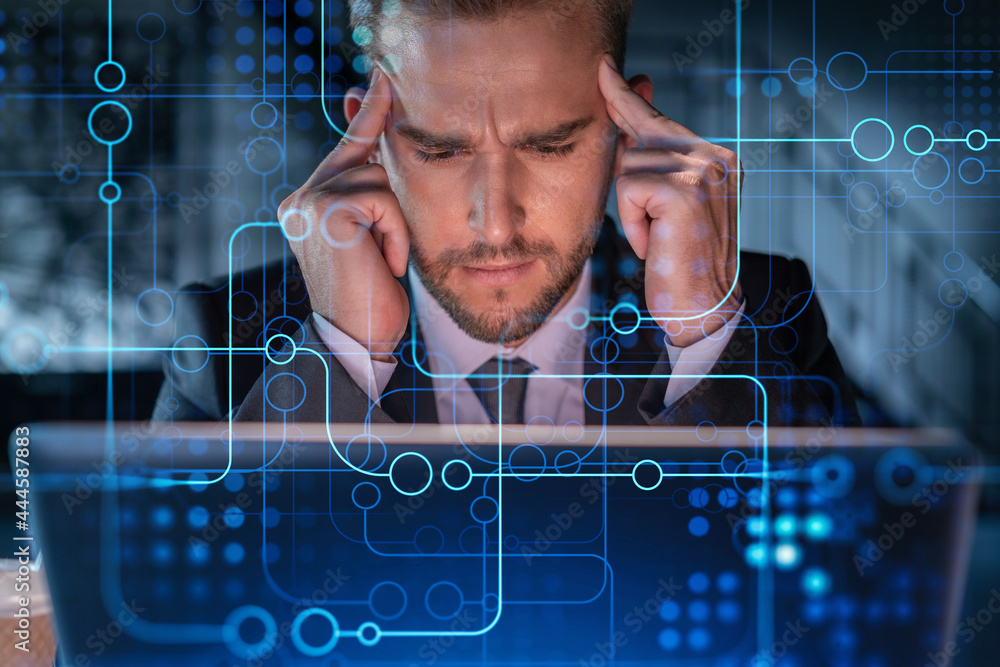 Poster handsome businessman in suit at workplace working with laptop to optimize development by implying ne