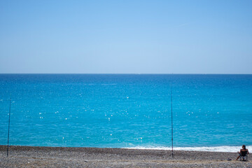 person fishing at the beach