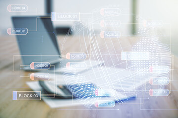 Abstract virtual coding concept and world map hologram on calculator and laptop background. Multiexposure