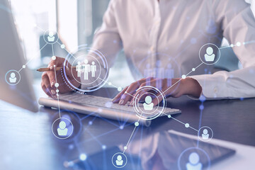 HR woman specialist is typing the keyboard in the internet to find the best candidates to create...
