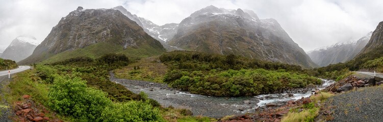 Mountainous Monkey creek flowing through impressive landscape next to Milford Sound highway, New Zealand