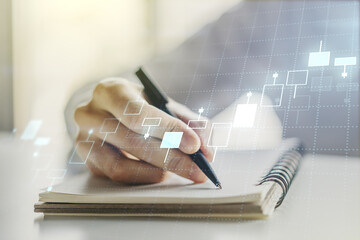 Multi exposure of abstract creative financial chart with hand writing in diary on background, research and analytics concept