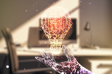 Obraz na płótnie Canvas Double exposure of creative light bulb hologram and modern desktop with laptop on background, research and development concept