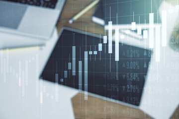Multi exposure of abstract financial diagram and modern digital tablet on background, banking and accounting concept