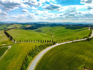Fototapeta na wymiar Pienza, Italy May 20 2021- aerial view of the Orcia valley in spring with drone