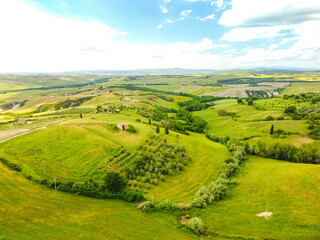 Fototapeta na wymiar Pienza, Italy May 20 2021- aerial view of the Orcia valley in spring with drone