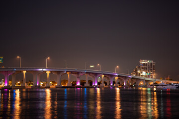 Obraz na płótnie Canvas Macarthur Causeway Miami lit neon blue at night