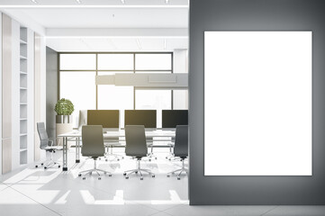 Modern coworking meeting room interior with bright city view, empty banner on wall and equipment. Mock up, 3D Rendering.
