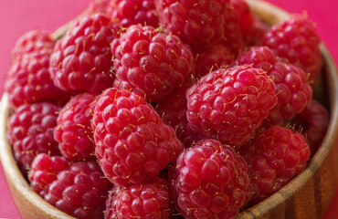 Fresh ripe juicy beautiful raspberries close up