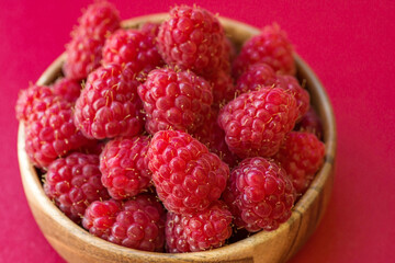 Fresh ripe juicy beautiful raspberries close up