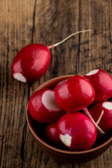fresh red radish at on a rustic table top