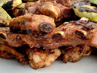 Delicious grilled pork ribs and young zucchini.