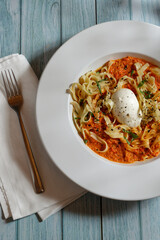 Tagliatelle with bell pepper sauce and burrata