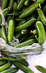 organic and fresh cucumbers in a market