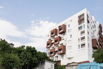 Modern hotel or apartment building on sky background