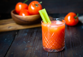 tomato juice in a glass with celery
