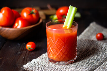 tomato juice in a glass with celery