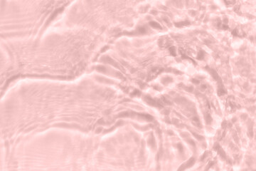 Subtle pink texture of light-shadow pattern of sunlight reflection from rippled water surface. Beautiful natural pattern with 3D feeling. 