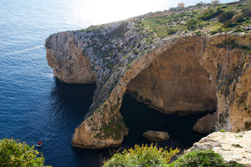 BLUE GROTTO, MALTA - 03 JAN, 2020: Blue Grotto and the Natural Arch are one of the attractions of...