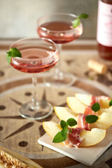 Traditional Spanish wine appetizer: melon and jamon.