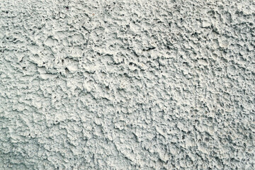 Rough plaster concrete wall for texture and background.