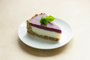 Cheesecake with berries and green mint. Gluten and sugar free vegan, healthy cake.
