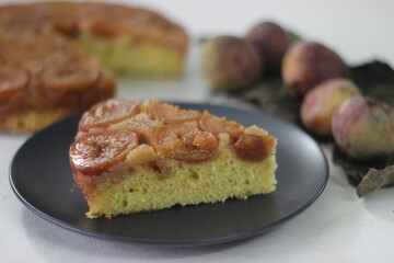 Slice of Fig upside down cake with lots of fresh figs and flavored with fresh orange juice.