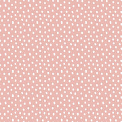 Vintage Polka Dot seamless pattern. White irregular spots, scattered various shape specks on pink background. Abstract vector texture for nursery print design, fashion textile, fabric, scrapbooking