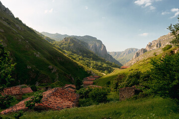 landscape with old buildings for ranchers in the high mountains. Picos de Europa National Park.