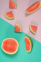 Close-Up Of Watermelon Slices On pink and green  Background.Funcy,abstract food background.
