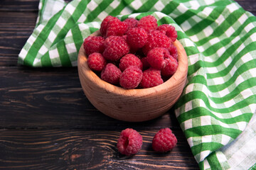 fresh raspberries on wooden background
