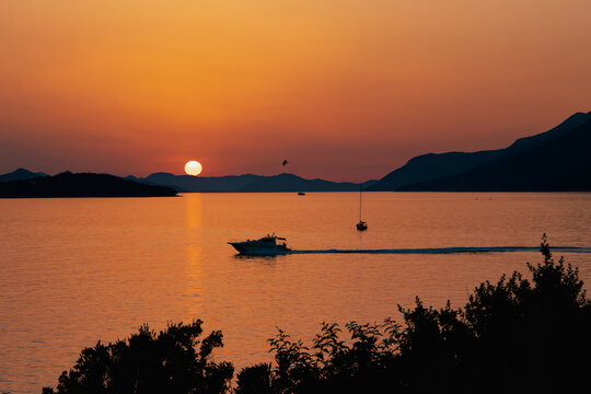 Amazing sunset seascape on the Dubrovnik beach, Lapad bay, Croatia. Natural outdoor travel background.