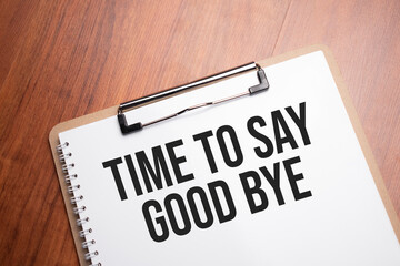 time to say good bye text on white paper on the wood table