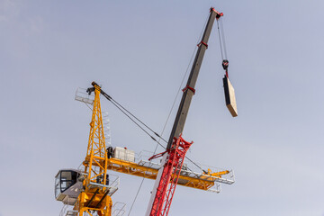 Construction crane assembly stage. Tower crane assembly. Installation of a construction crane before starting construction.