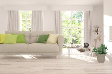White living room with sofa and summer landscape in window. Scandinavian interior design. 3D illustration