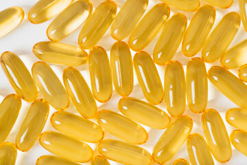 Cod liver oil omega 3 gel capsules isolated on white background. Food supplements for sports