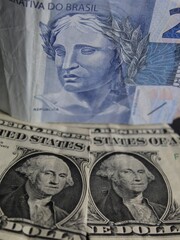 economy and finance with brazilian and american dollar money