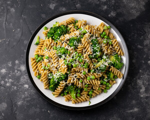 Green peas, broccoli pasta with pesto sauce and parmesan cheese. healthy food.