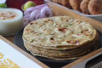 A high protein Indian flat bread with whole wheat and lentils. Popularly known as moong dal paratha...