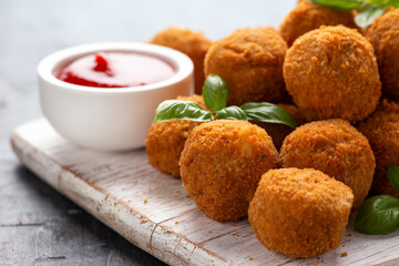 Meat free vegetarian mini picnic scotch eggs with micoprotein and herbs served with ketchup and...