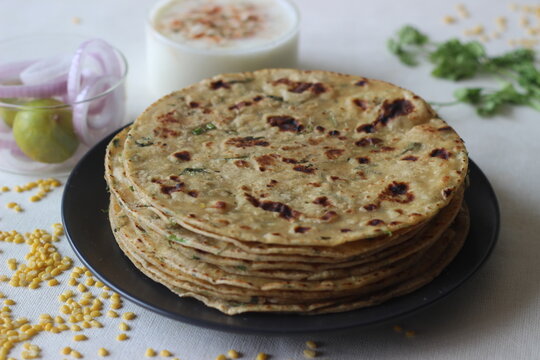 A high protein Indian flat bread with whole wheat and lentils. Popularly known as moong dal paratha in many parts of India