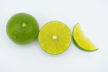 Fresh green lemon isolated on white background.