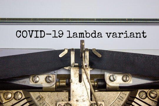 Covid-19 lambda virus variant symbol. Words 'Covid-19 lambda variant' typed on retro typewriter. Medical and COVID-19 new lambda variant concept.