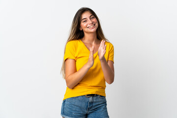 Young caucasian woman isolated on white background applauding after presentation in a conference