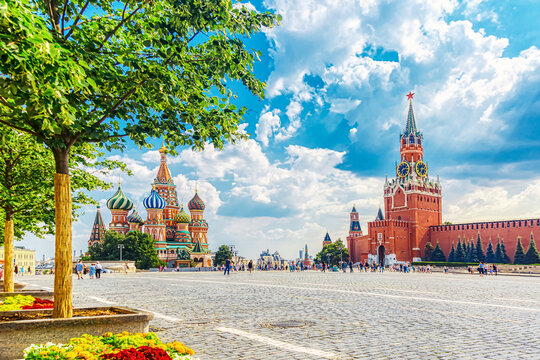 Moscow landscape. Red Square with Spasskaya Tower of the Moscow Kremlin and St. Basil's Cathedral. Summer sunny day