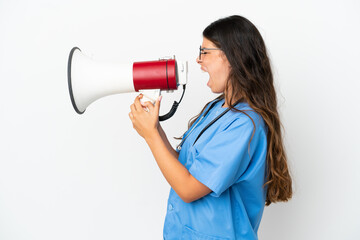 Young surgeon doctor caucasian woman isolated on white background shouting through a megaphone