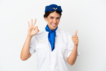 Airplane stewardess caucasian woman isolated on white background showing ok sign and thumb up gesture