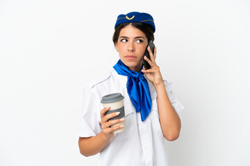 Airplane stewardess caucasian woman isolated on white background holding coffee to take away and a mobile