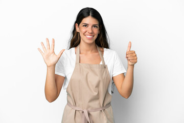 Restaurant waiter over isolated white background counting six with fingers